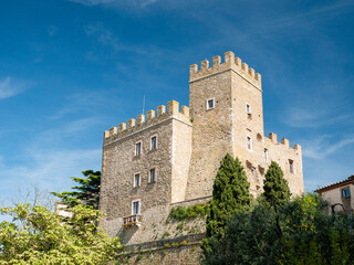 Medieval Manciano Castle: Tuscan Fortress Towering Against Azure Summer Sky