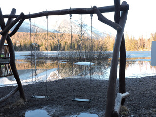 Fototapeta premium Swing at Štrbské Pleso in the High Tatras in romantic time.
