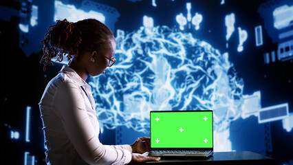 Admin updating AI systems using chroma key laptop, writing intricate binary code scripts. Technical...