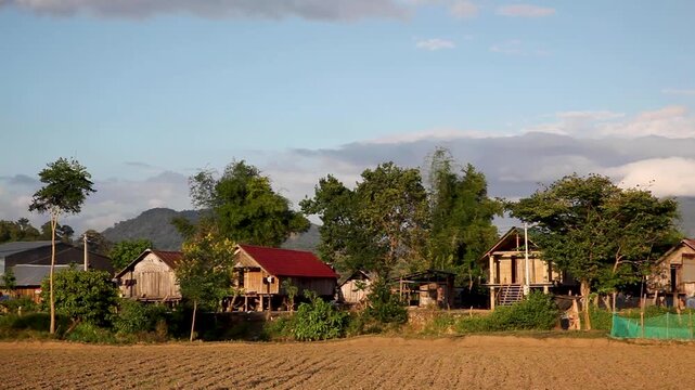 Minority village with fields and traditional longhouses, Lak Lake, Vietnam, Asia
