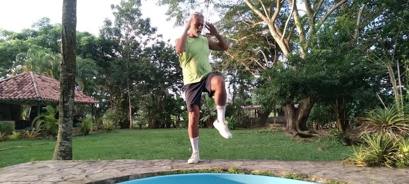 50 year old man doing basic calisthenics exercises