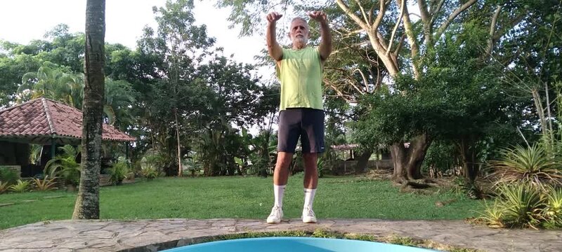 50 year old man doing basic calisthenics exercises