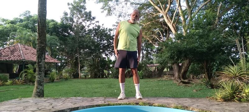 50 year old man doing basic calisthenics exercises