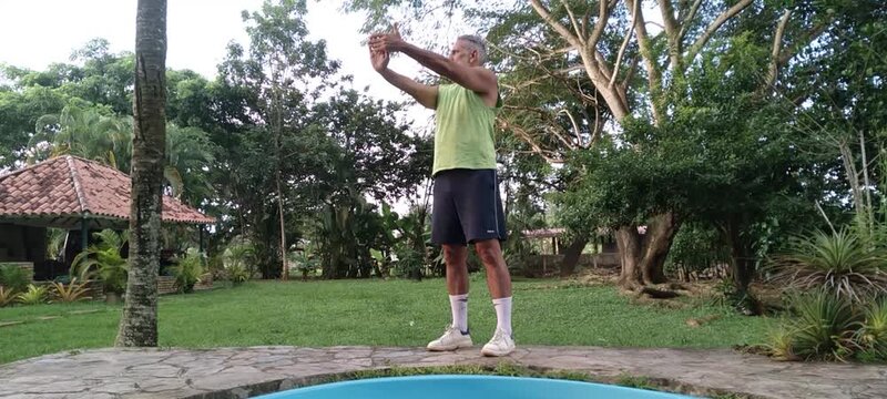50 year old man doing basic calisthenics exercises