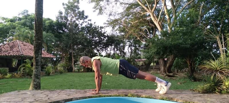 50 year old man doing basic calisthenics exercises