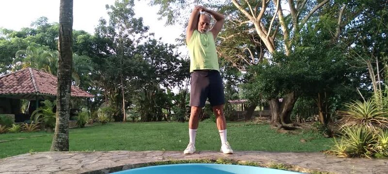 50 year old man doing basic calisthenics exercises