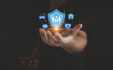 Business people holding and giving insurance and assurance icons including family health real...