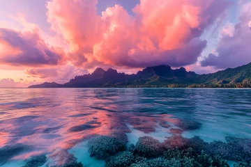Vibrant sunrise clouds over mount otemanu, bora bora, with azure ocean and coral reef