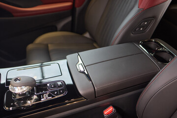 The car features a highend interior, but shows wear and tear with a armrest