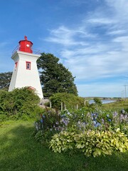 Lighthouse against a beautiful summer sky in the maritimes of Canada