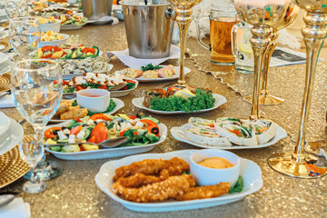 cold meats, vegetable salads, fruit salads Preparation of dishes for an all-inclusive banquet in a resort hotel. Empty all inclusive line, restaurant equipment