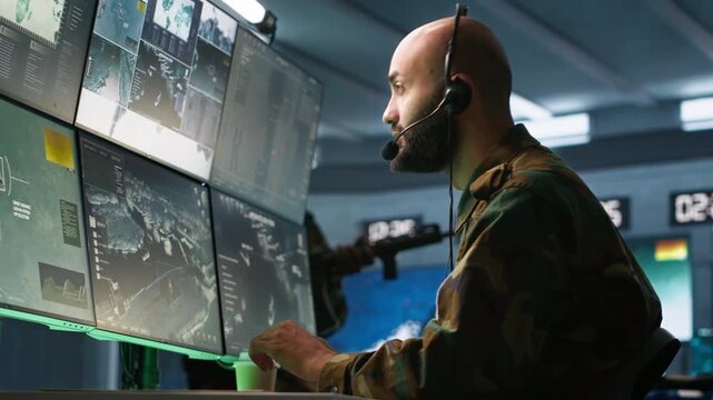 Military dispatcher using headphones microphone, offering info to infantry units fighting on front lines. Army expert providing intel for troops, coordinating mission activities, camera A