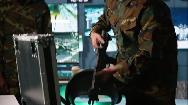 Army soldiers packing weapons able to engage targets at extended range with accurate, lethal fire. Military units loading guns with bullets, preparing for enemy suppression mission, camera A