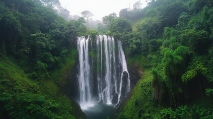 Fototapeta premium Majestic Waterfall Surrounded by Lush Greenery