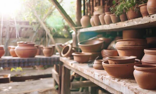 Pottery Workshop with Assorted Clay Pots and Shelves