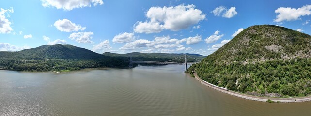 View of bridge in upstate new york with blue sky and clouds