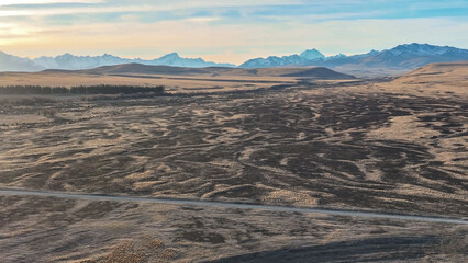 The dry agricultural countryside of the Mackenzie country near the small town of Twizel