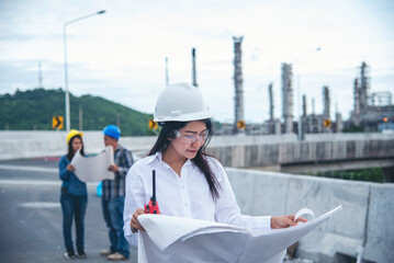 Two engineer women look at blueprint architecture building contractor designer teamwork. Engineer woman holding project planing partner teamwork. Two woman meeting together construction site Industry