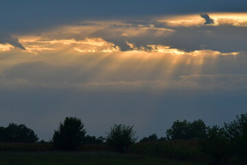Cloudy Sunset with Sunbeams