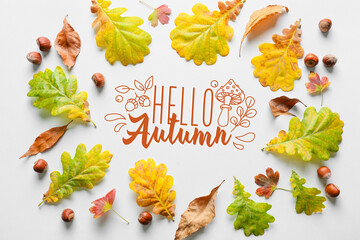 Frame made of autumn leaves on white background