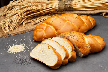 Freshly baked challah bread with sesame seeds, perfect for breakfast or dinner