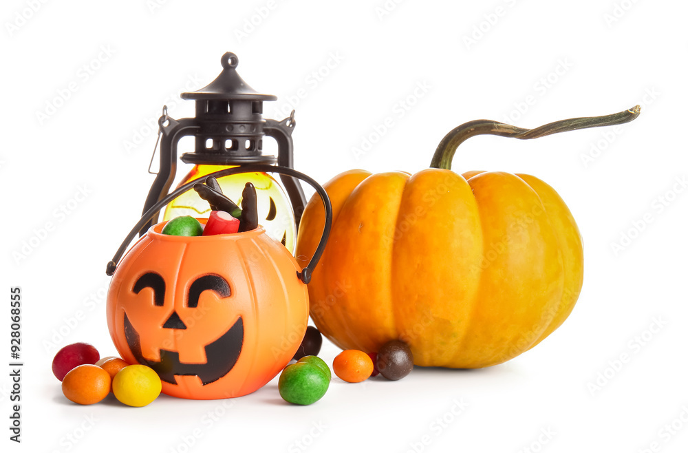 Wall mural composition with sweet treats, pumpkin and lantern on white background