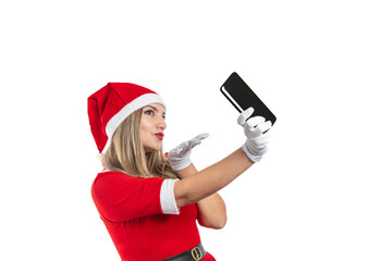 Young blonde girl dressed as Santa Claus blowing a kiss to a cell phone