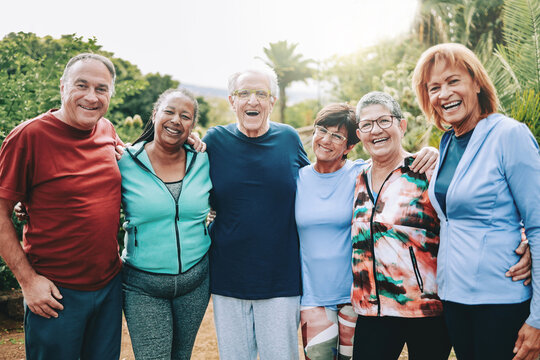 Older people, Senior sport friends hug after yoga or pilates training at park city. Healthy life style