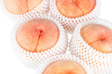 Fresh peaches are wrapped in a fruit packaging net. transparent background
