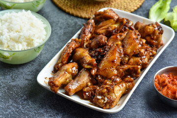 Asian style grilled chicken wings in soy-honey sauce