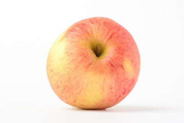Fresh ripe apple with tiny water drops on white background