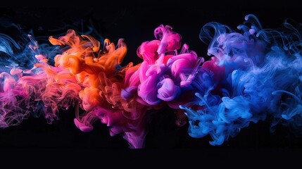 Vivid clouds of pink, blue, and orange ink swirling and blending against a black background, creating a mesmerizing abstract pattern.