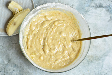 Mixing ingredients for cooking on gray background