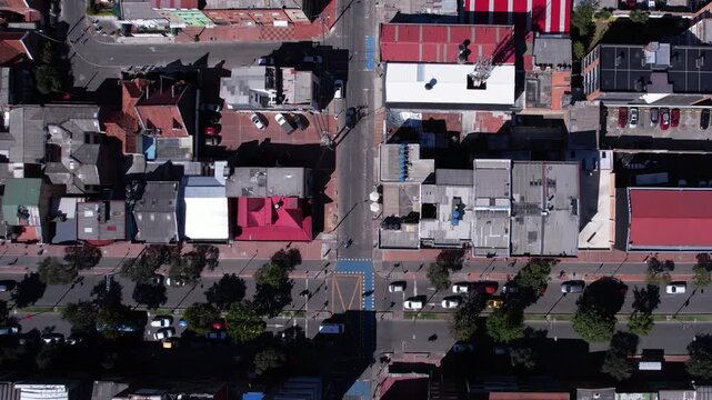 Top Down Aerial View of Street Traffic and Buildings in Urban City of Latin America, High Angle Drone Shot