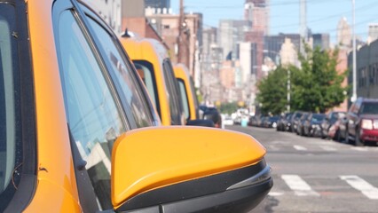 New York City. Row of yellow Taxi cars on street, Queens. Many taxi cabs on avenue, Long Island,...