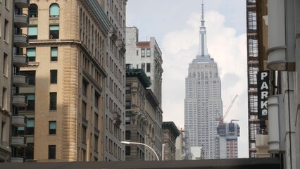 New York City Manhattan Midtown street architecture. Empire State building, iconic skyscraper in USA. American urban cityscape, famous NYC tower, United States. 5th Fifth 5 avenue. Greenwich village.
