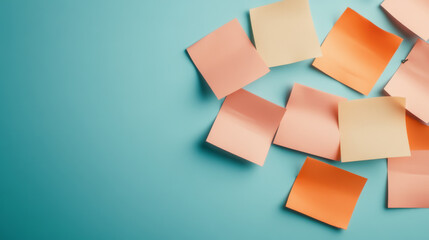 Colorful sticky notes scattered on a blue background, perfect for reminders and organization in office or study environments.