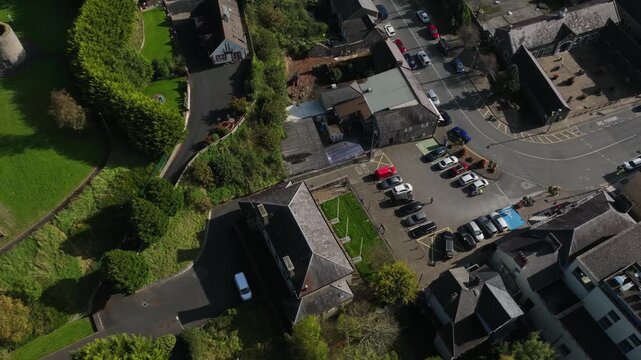 Carrickmacross Town, County Monaghan, Ireland, November 2022. Drone in Bird's Eye counter clockwise orbit descends to establish front facing facade of The Courthouse on a bright sunny afternoon.