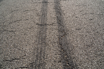 Traces of car tires on the road