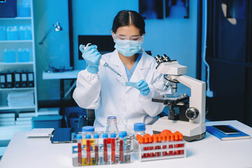 Female scientist working with micro pipettes analyzing biochemical samples, advanced science...