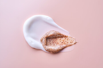 Cream and cream scrub on a pink background. Texture.