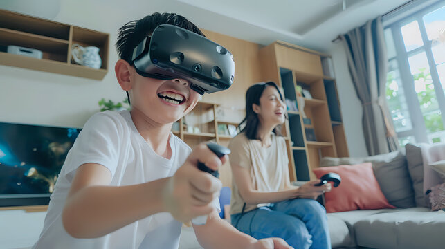 A young boy enjoying a video game with his mother in a living room, decorated with plants, a couch, and a chair.