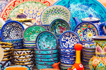 Multicolored ceramic dishes with oriental ornaments at the Siab Bazaar.