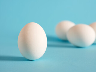 White egg on blue background.