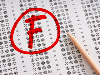 Test exam grade F with a red circle on a sheet of paper with pencil.