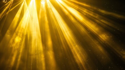 Obraz premium Bright spotlight beams shining on vibrant yellow background with illuminated light rays, perfect for theater, stage lighting concepts, and event promotion backdrops with copy space for text