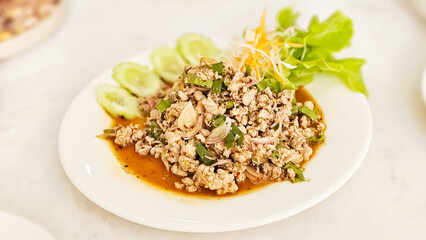 Thai Food, Isaan Food Dishes Larb Koi. Pork spicy salad. Northeastern Thai Dishes. Boiled minced pork mixed with spices is spicy.