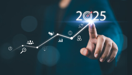 The 2025 new year business goals concept. Businessman touching increase arrow graph company future...