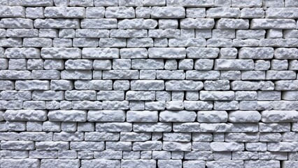 Obraz premium a white brick wall with a white brick pattern