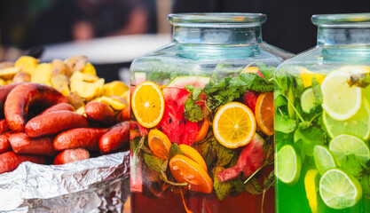 Lemonade with fruits and berries in a glass jar